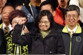 Tsai Ing-wen raises her hand as she declares victory in the presidential election, in Taipei, Taiwan [AP]