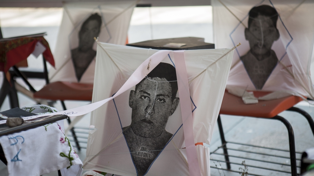 Kites commemorate some of the missing students [Eduardo Miranda/Al Jazeera]