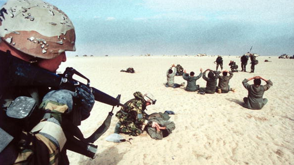 Iraqi POWs, taken by US Marines, fanning out in desert, during Gulf War Desert Storm ground campaign in 1991 [Getty Images]