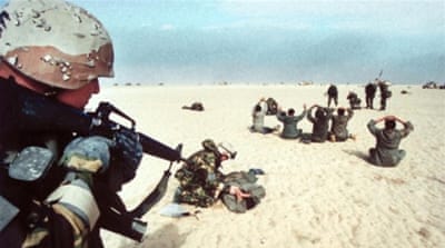 Iraqi POWs, taken by US Marines, fanning out in desert, during Gulf War Desert Storm ground campaign (1991) [Getty]