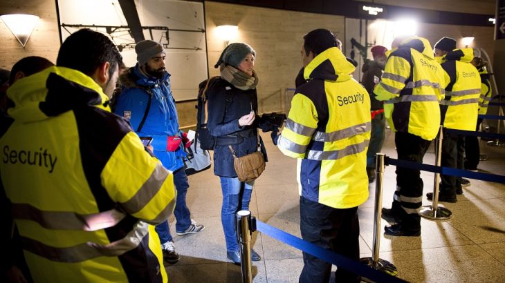 Security staff check people''s identification at Kastrups train station outside Copenhagen