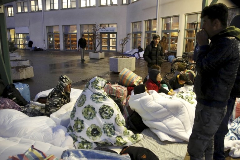 Refugees sleep outside the entrance of the Swedish Migration Agency''s arrival center for asylum seekers at Jagersro in Malmo