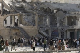 People gather outside the house of court judge Yahya Rubaid after a Saudi-led air strike destroyed it, killing him, his wife and five other family members, in Yemen''s capital Sanaa