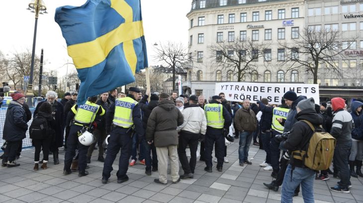 Stockholm Police talk to participants of a movement calling itself "The People''s Demonstration", which held a meeting and demonstration at Norrmalmstorg square in Stockholm