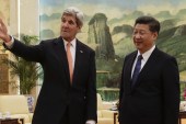 US Secretary of State John Kerry with Chinese President Xi Jinping in Beijing [AP]