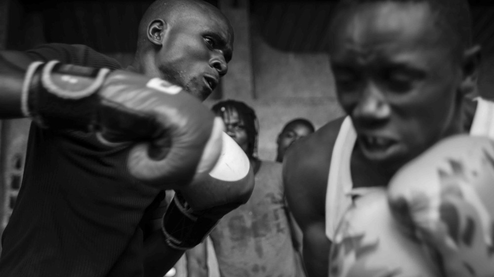Street children and child soldiers attend a boxing school in Goma [Raquel Villaécija/Al Jazeera] 