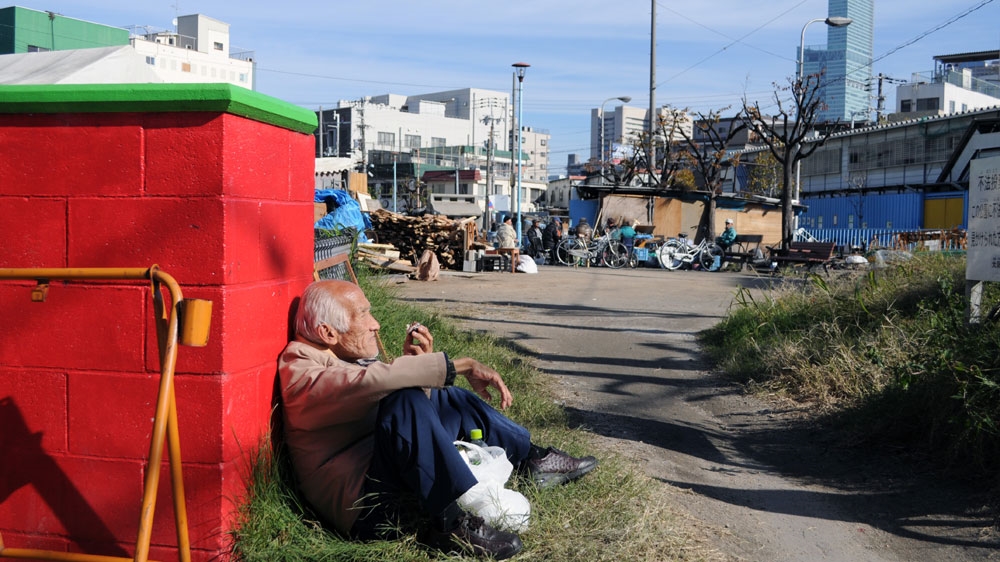 A park popular with homeless and destitute people in the heart of Kamagasaki district [Joe Jackson/Al Jazeera]