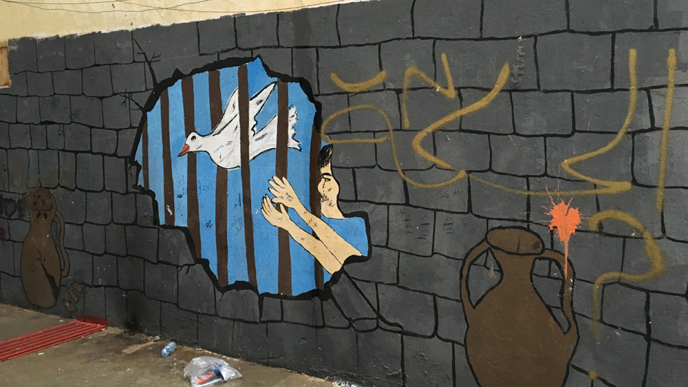 A dove tries to fly through the bars of the prison that Syria has become [Mohammed Jamjoom/Al Jazeera]