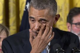 President Barack Obama wipes tears from his eyes as he speaks in the East Room of the White House in Washington [AP]
