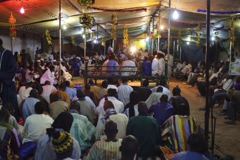 People from the Mouride sect of Sufi Islam attend a prayer session in the village of Ndande