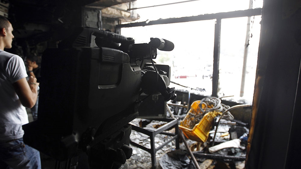  The burned-out interior of an Al Jazeera studio in Cairo after an attack in November 2012 [Reuters]