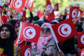 Tunisian women wave national flags and shout slogans during celebrations to mark the fifth anniversary of the uprising that removed President Zine El Abidine Ben Ali [Reuters]