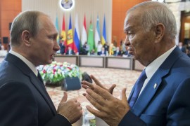 Uzbekistan''s President Karimov talks to Russian President Putin during meeting of ex-Soviet leaders in Burabai