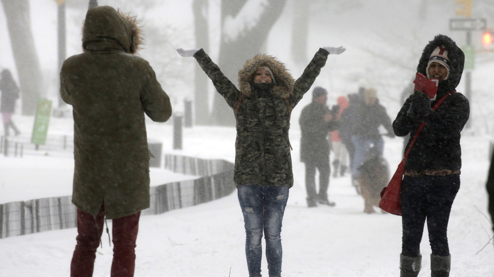 People in Central Park enjoyed the snow during the first major winter storm of 2016 in New York [Peter Foley/EPA]