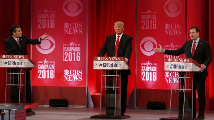 Republican U.S. presidential candidates Cruz and Rubio both gesture at Trump during the Republican U.S. presidential candidates debate sponsored by CBS News and the Republican National Committee
