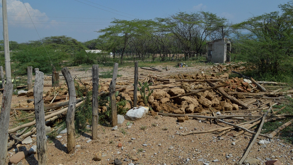 Remains of demolished houses are everywhere in Las Casitas. Since Cerrejon asked the residents to move out of the village in 2009, the majority of the people have left [Fredrik Brogeland Laache/Al Jazeera]