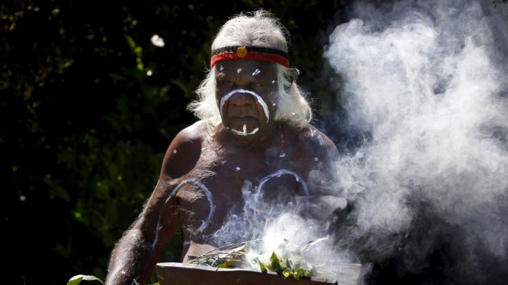 File picture of Aboriginal elder Max Eulo performing a smoking ceremony during an official function on the foreshore of Sydney Harbour, Australia