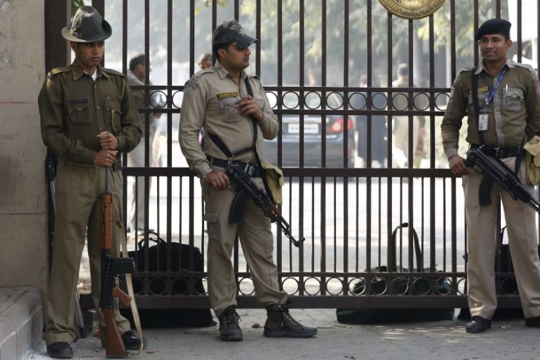 Policemen stand guard outside the high court during the bail hearing of Kanhaiya Kumar in New Delhi