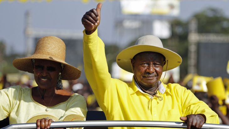 Accompanied by his wife Janet Museveni (L), Uganda''s incumbent President Yoweri Museveni (R) greets his supporters upon his arrival at his last campaign rally in Kampala, Uganda, 16 February 2016