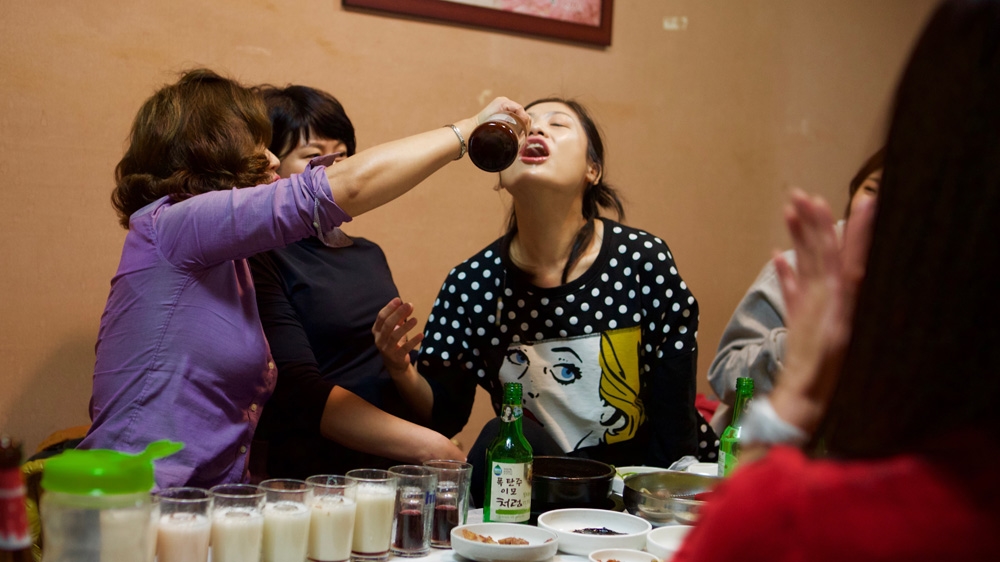 Ham Soonbok, aka the 'Bomb Shot Aunty', is known to hold legendary drinking parties at her restaurant. Many come from all over South Korea to try her various cocktails [Steve Chao/Al Jazeera] 