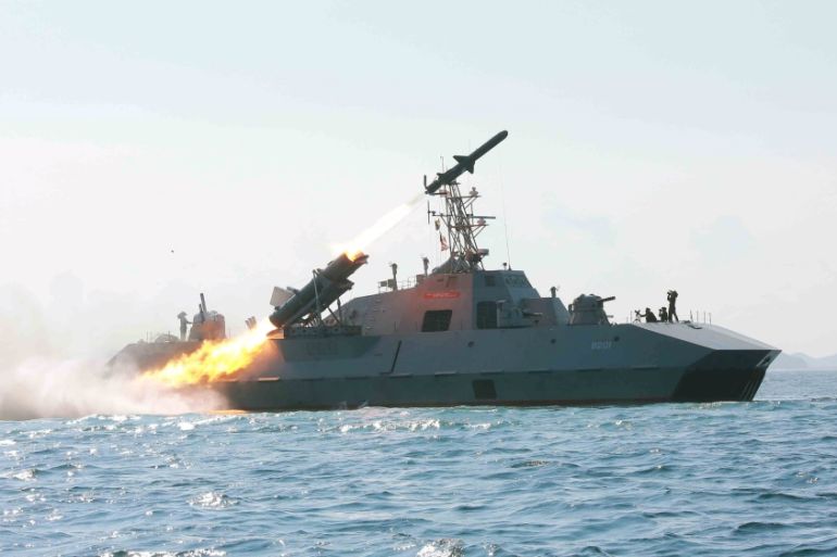 KCNA picture shows a test-firing drill of anti-ship missiles at sea