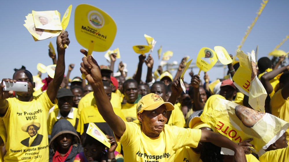 Supporters of Uganda's incumbent President Yoweri Museveni react as they listen to his speech during his last campaign rally in Kampala on February 16 [EPA/Dai Kurokawa]