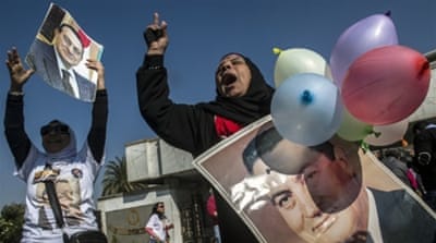 Supporters of Egypt's former president Hosni Mubarak celebrate outside Maadi military hospital in Cairo in 2014 after a court dismissed a murder charge against the ousted leader [AFP]