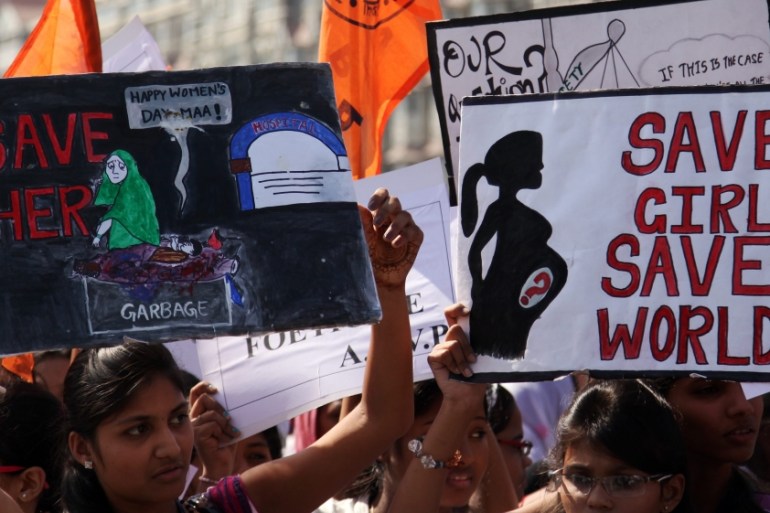 Indian students from various schools and colleges shouts slogans to spread awareness about female foeticide in Mumbai.