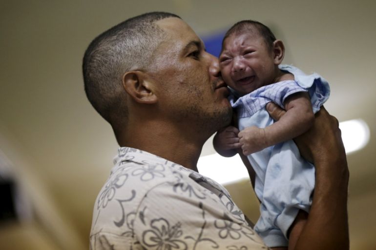 Geovane Silva holds his son Gustavo Henrique, who has microcephaly, at the Oswaldo Cruz Hospital in Recife, Brazil