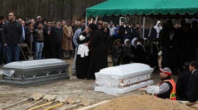 The burial of the three murdered students at the Muslim Cemetery of the Islamic Association of Raleigh in North Carolina last February [Getty]