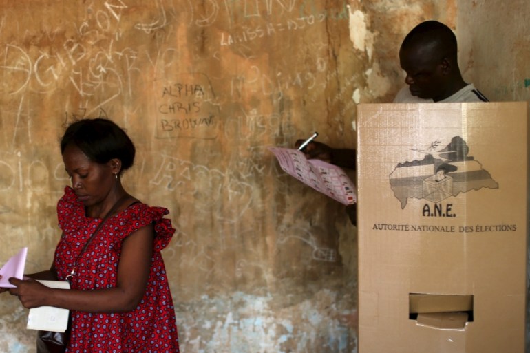 Voters choose their candidates during the second round of presidential and legislative elections in the mostly Muslim PK5 neighbourhood of Bangui, Central African Republic