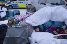 File photo of Syrian children Nor, Saleh and Hajaj Fatema sleeping outside the Swedish Migration Board in Marsta, outside Stockholm