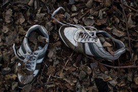 A pair of sneakers left by a refugee lies in the wood near the Hungarian-Serbian border [Getty]