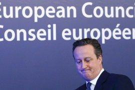 British Prime Minister David Cameron waves as he leaves a European Union leaders'' summit in Brussels [REUTERS]