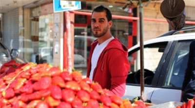 Strawberry seller Abudullah Nasaar was out of work for three days during the closure [Abed al-Qaisi/Al Jazeera]