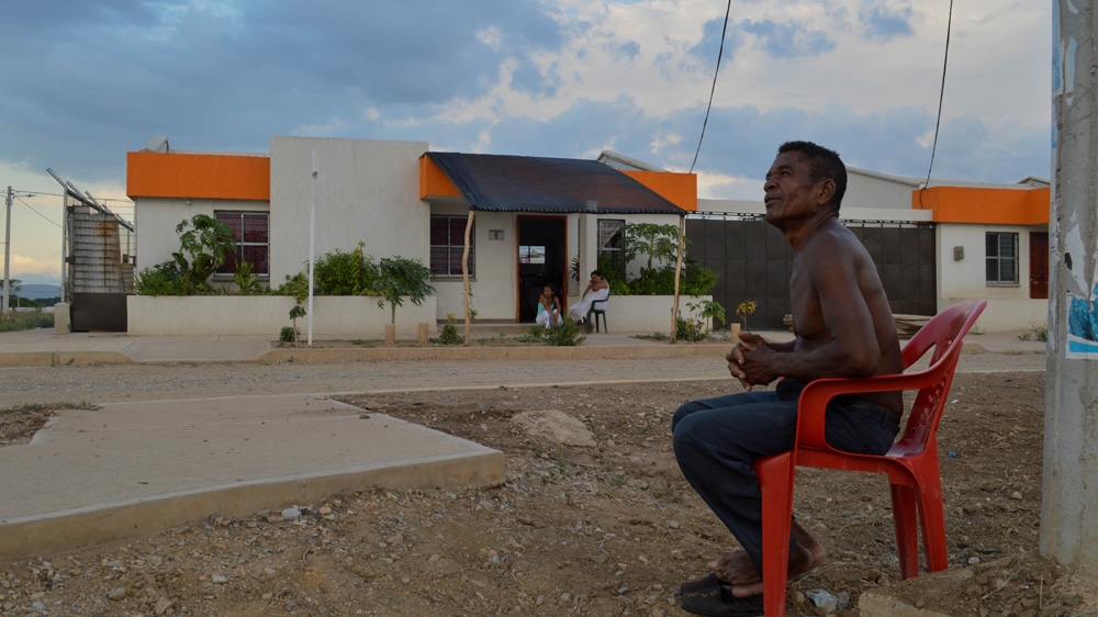 Alonso Rafael Molina, 61, relocated to Las Nuevas Casitas with his wife and five children last year. He complains about the lack of work in his new urban village [Fredrik Brogeland Laache/Al Jazeera]