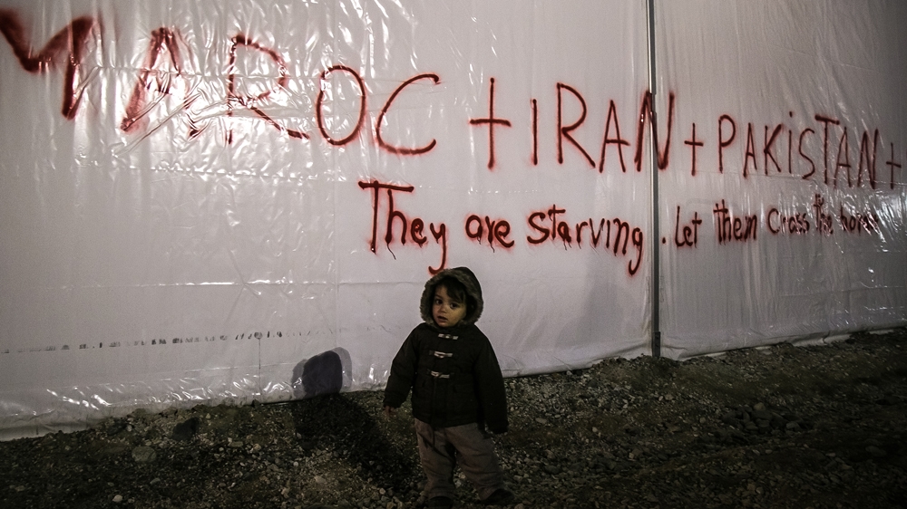 A small child outside one of the tents, where in October some non-Syrian, Afghan or Iraqi asylum seekers protested against the closure of the border to them [Nicola Zolin/Al Jazeera]