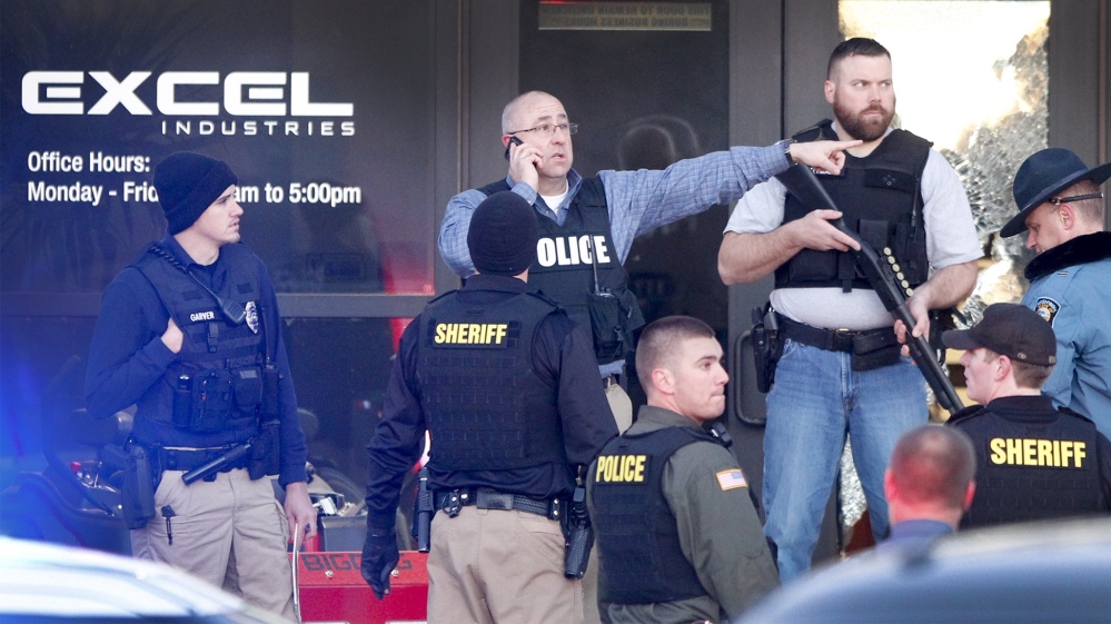 Police guard the front door of Excel Industries in Hesston, Kansas, where a gunman killed several people and injured many more (Fernando Salazar/The Wichita Eagle via AP)