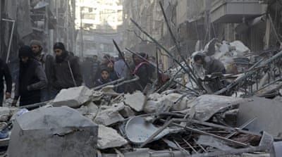 Residents inspect damage after air strikes  in the rebel held al-Shaar neighborhood of Aleppo[Abdalrhman Ismail/Reuters]