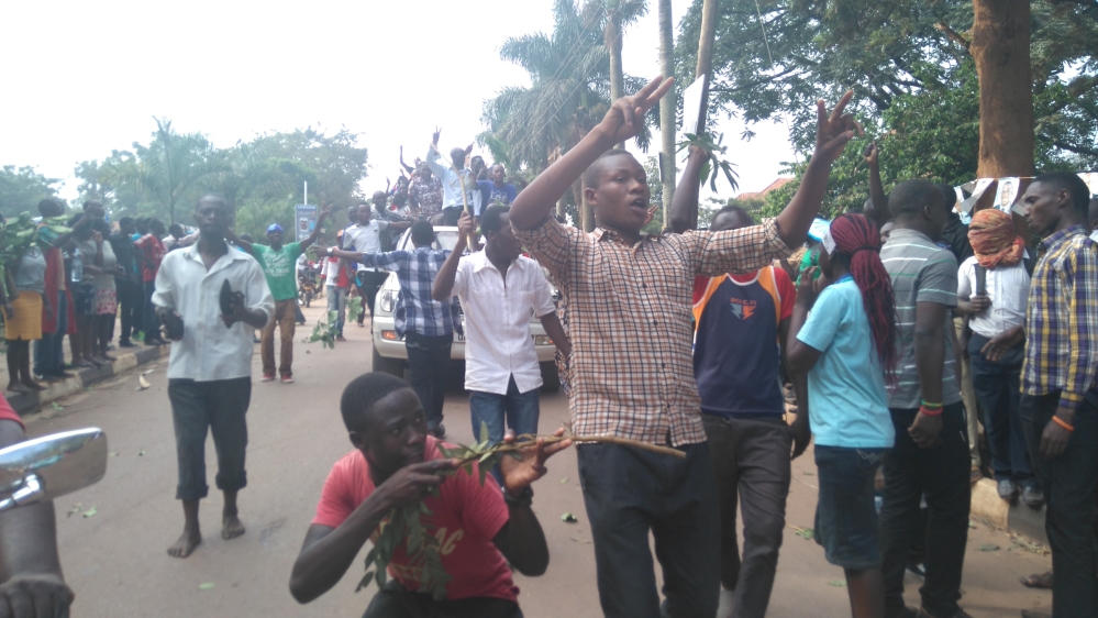 Students demonstrating at Makerere University in Uganda's capital, Kampala [Tendai Marima/Al Jazeera]