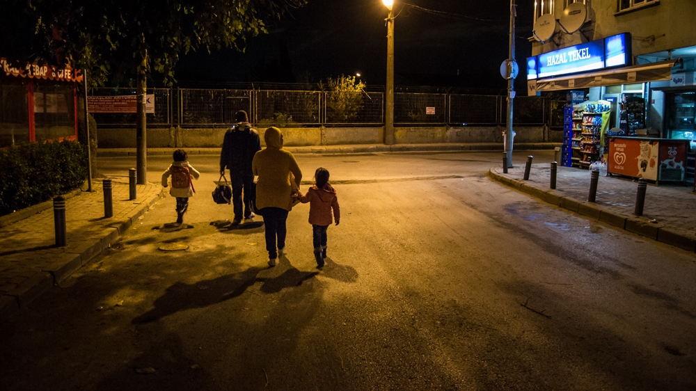 The family decide to take the night bus back to Izmir and once again join the refugee caravan [Pieter Stockmans/Al Jazeera]