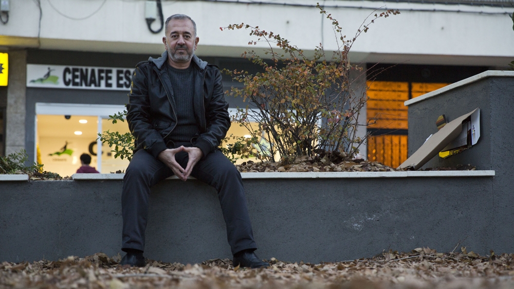 Mohsen poses in front of CENAFE, where he works in Getafe [David Fernandez/ Al Jazeera] 