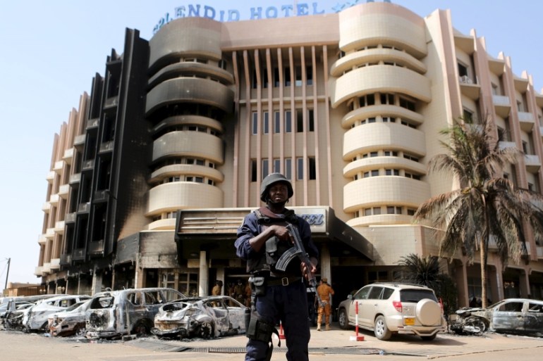 A soldiers stands guard in front of Splendid Hotel in Ouagadougou