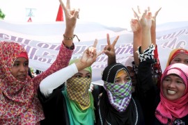 Muslim women gesture as they join hundreds of peace advocates in a peace march towards the House of Representatives in Quezon City, metro Manila