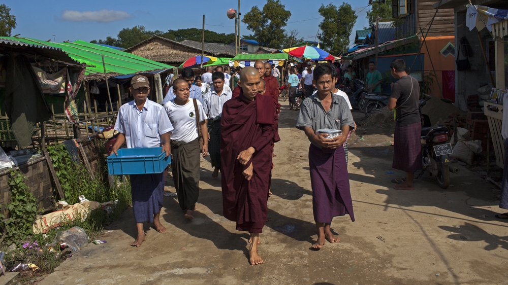 Buddhist monk Ottamasara leads an alms collection at the Saytanar (Mercy) village, near Thanlyin, Myanmar [Will Baxter/Al Jazeera] 