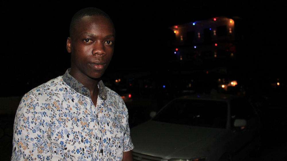 Kivumbi Charles, 20. Diploma in journalism. Cashier at a sports betting shop. Kampala, Uganda [Trinna Leong/Al Jazeera] 