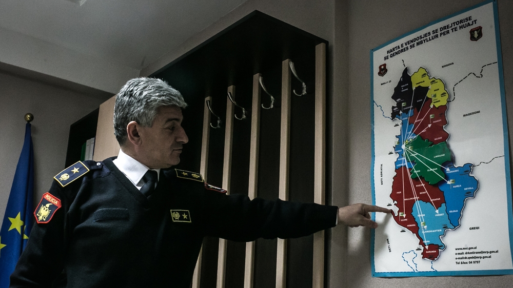 Gezim Goci, the director of the detention centre in Karrec, points out possible migrant routes in Albania [Nicola Zolin/Al Jazeera] 