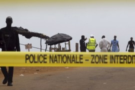 A police cordon is seen while Ivorian police prepare to inspect the area of the hotel Etoile du Sud following an attack by gunmen from al Qaeda''s North African branch, in Grand Bassam