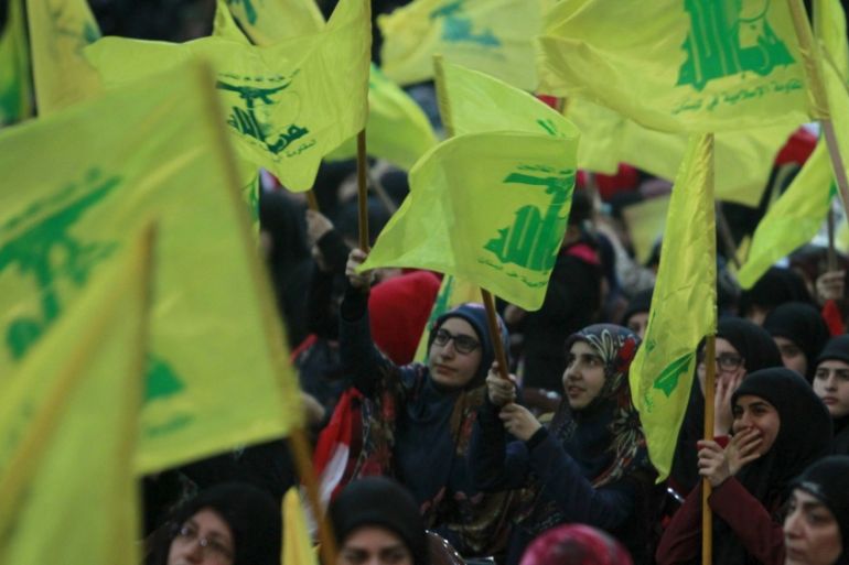 Supporters of Lebanon''s Hezbollah leader Sayyed Hassan Nasrallah wav