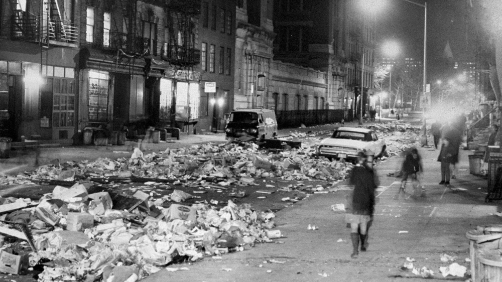 Rubbish floods East 10th Street, New York, between Avenues B and C during the refuse collectors' strike [Vincent Riehl/Getty Images] 